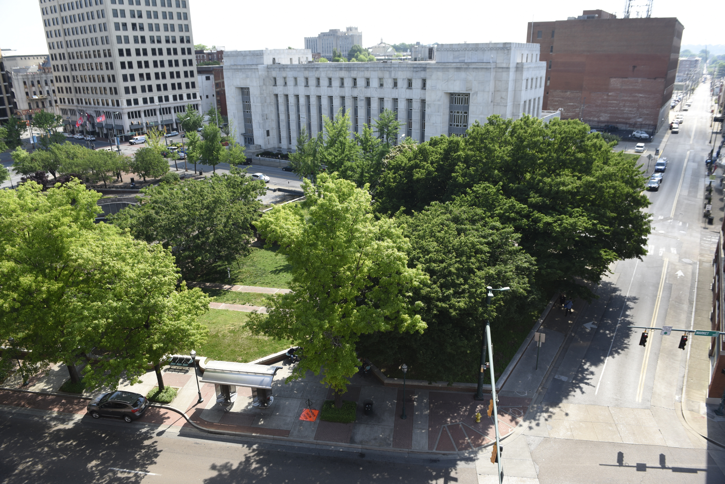 Mature trees block the view of Miller Park, photographed from the EPB parking garage on Wednesday, Apr. 27, 2016, in Chattanooga, Tenn.