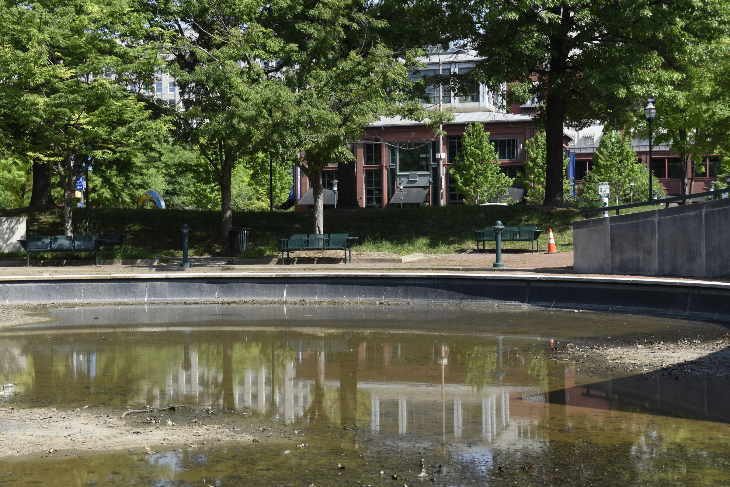 Largely drained of water, the pool at Miller Park is photographed on Wednesday, Apr. 27, 2016, in Chattanooga, Tenn. Miller Park is city-owned, while Miller Plaza, seen in the background, is privately owned by the River City Company.
