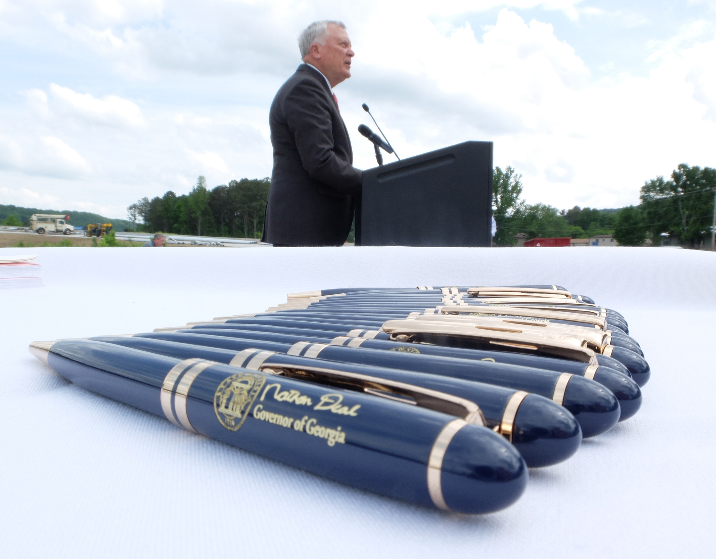 Pens lay at the ready before Georgia Gov. Nathan Deal signs the State Budget on a construction site of Interstate 75, Monday in Dalton Georgia.