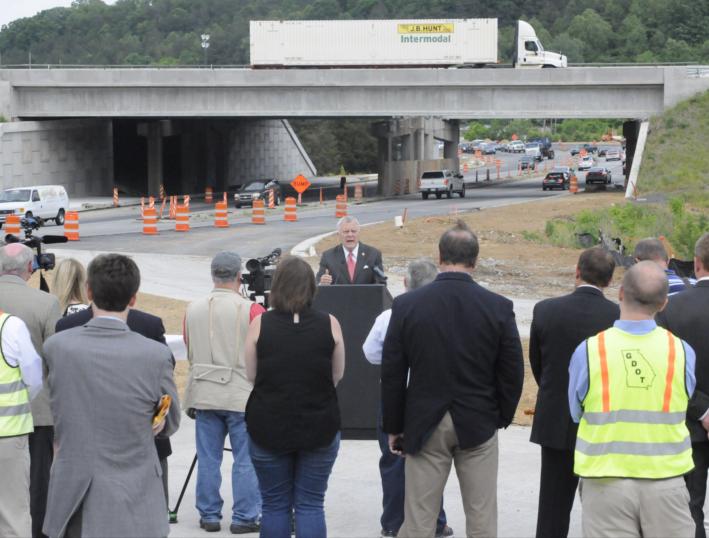 Georgia Gov. Nathan Deal speaks to the press and attendees Monday before signing the State Budget on an Interstate 75 entrance ramp Monday in Dalton Georgia.