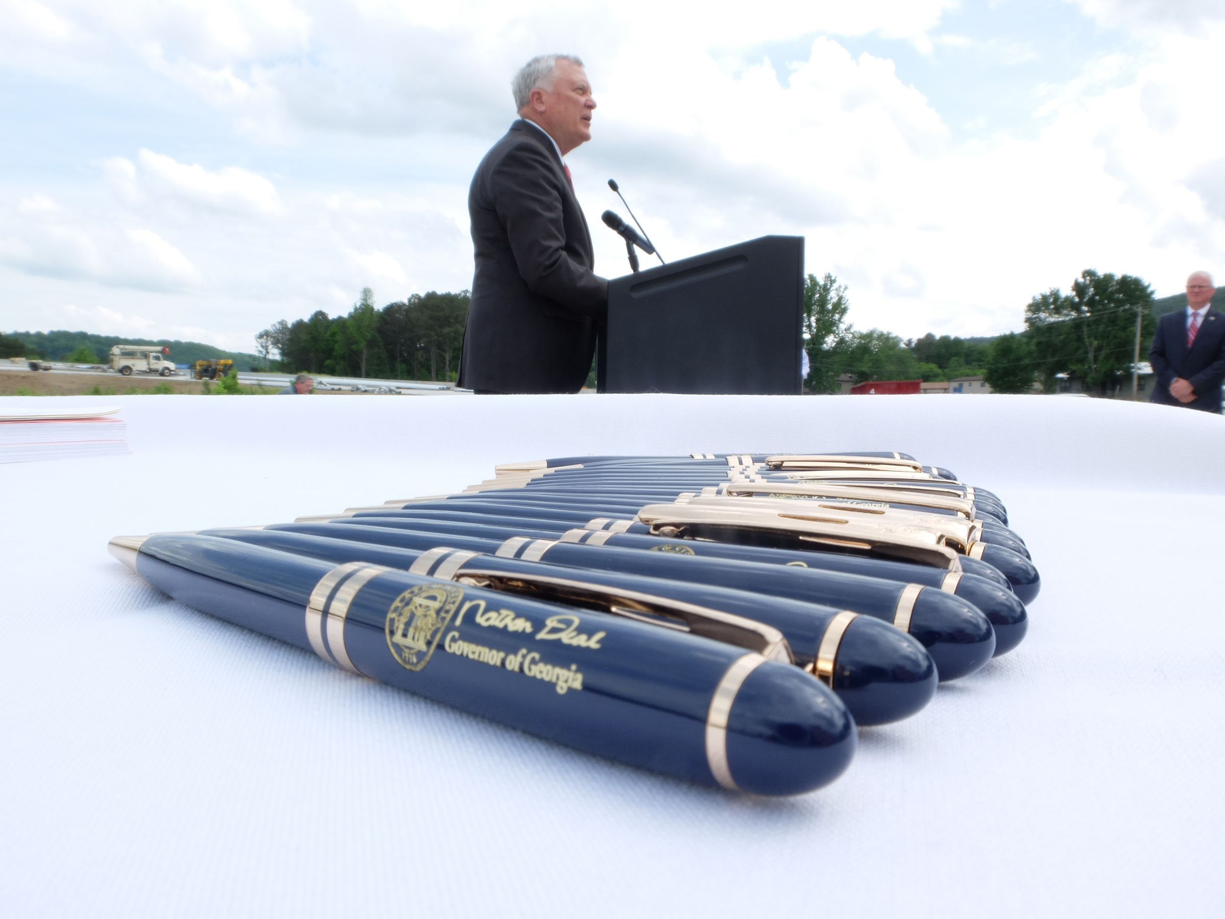 Pens lay at the ready before Georgia Gov. Nathan Deal signs the State Budget on a construction site of Interstate 75, Monday in Dalton Georgia.