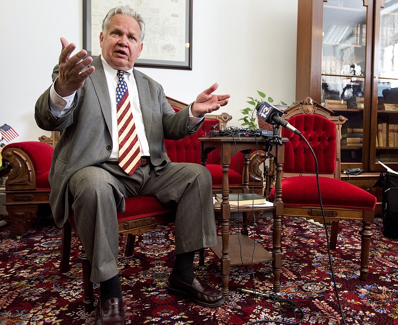 Alabama State Auditor Jim Zeigler, sitting next to an empty seat, reacts to Governor Robert Bentley not showing up after being ordered to appear before him at the state capitol building in Montgomery, Ala., on Monday May 2, 2016. 