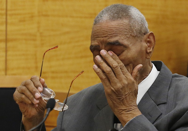 Paul Gatling wipes away tears as a Brooklyn Supreme Court judge exonerates him, Monday, May 2, 2016, in New York. The Virginia man spent nearly a decade in prison after being wrongly convicted of murdering an artist in Brooklyn in 1963. At the request of Brooklyn District Attorney Ken Thompson, a New York judge on Monday vacated the conviction of 81-year-old Gatling for the 1963 shooting death of Lawrence Rothbort.