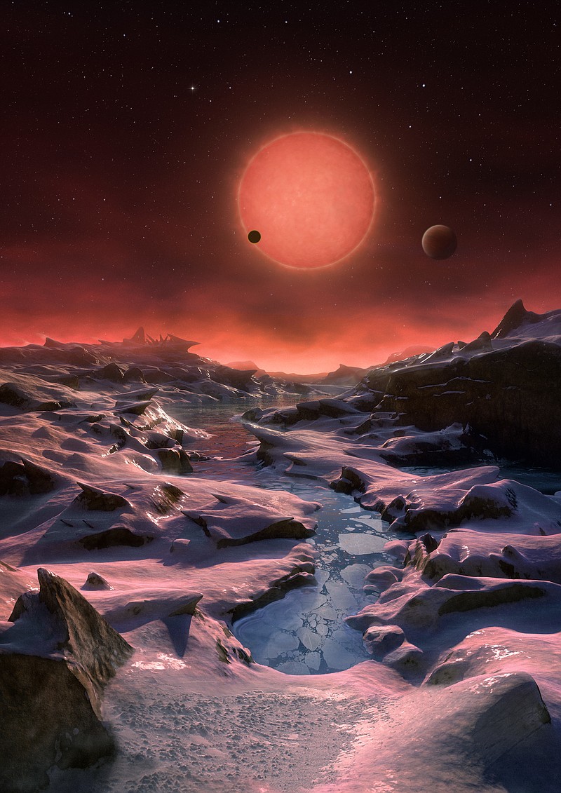 The artist's impression provided by European Southern Observatory on May 2, 2016 shows an imagined view from the surface one of the three planets orbiting an ultracool dwarf star just 40 light-years from earth that were discovered using the TRAPPIST telescope at ESO's La Silla Observatory.