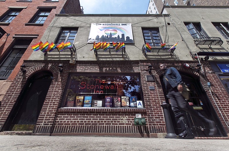 
              FILE - This May 29, 2014 file photo shows The Stonewall Inn, in New York's Greenwich Village. President Barack Obama is preparing to designate the Stonewall Inn in New York the first national monument dedicated to gay rights. (AP Photo/Richard Drew, File)
            