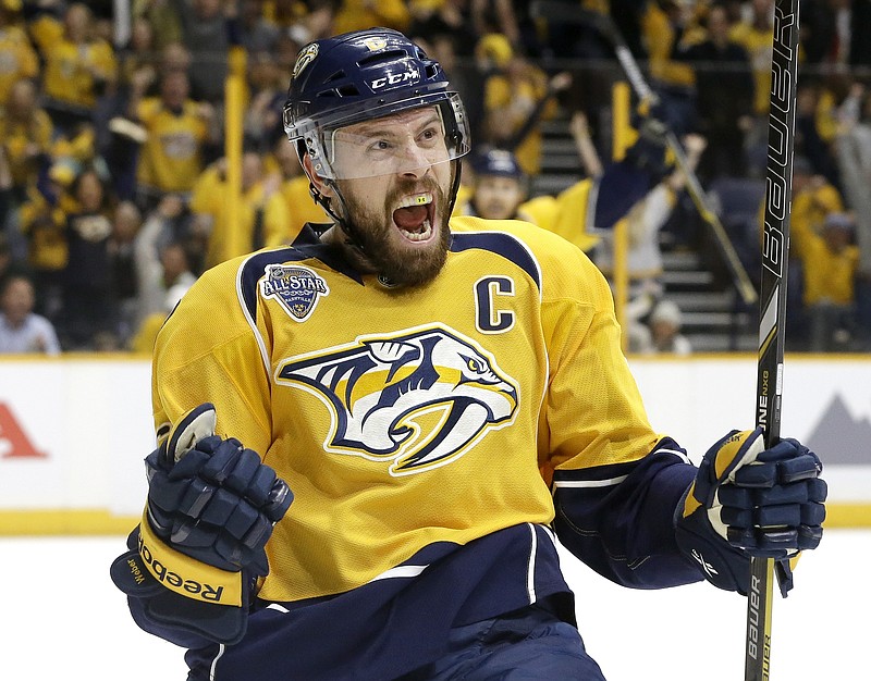 
              Nashville Predators defenseman Shea Weber celebrates after scoring a goal against the San Jose Sharks during the second period in Game 3 of an NHL hockey Stanley Cup Western Conference semifinal playoff series Tuesday, May 3, 2016, in Nashville, Tenn. (AP Photo/Mark Humphrey)
            