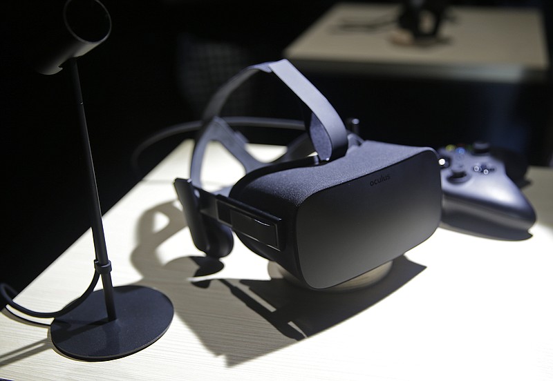 
              FILE - In this June 11, 2015, file photo, the new Oculus Rift virtual reality headset is on display following a news conference in San Francisco. Best Buy will sell the Oculus Rift virtual-reality headsets at some of its retail stores starting Saturday, May, 7, 2016. (AP Photo/Eric Risberg, File)
            