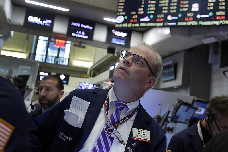 
              FILE - In this Thursday, April 28, 2016, file photo, trader David O'Day works on the floor of the New York Stock Exchange. U.S. companies are on track for their third straight decline in quarterly earnings, the worst streak since the financial crisis, a result of low oil prices and weak economic growth. (AP Photo/Richard Drew, File)
            