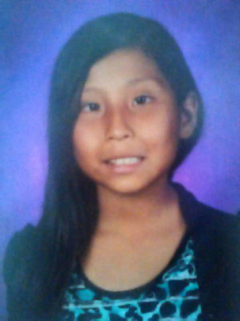
              This undated photo provided by the New Mexico State Police shows Ashlynne Mike. The air and ground search for the abducted Navajo girl ended tragically Tuesday, May 3, 2016, when authorities found the 11-year-old dead near the towering rock formation that gives the New Mexico town of Shiprock its name. Ashlynne Mike was kidnapped from the Navajo Nation, FBI spokesman Frank Fisher said.  (New Mexico State Police via AP)
            