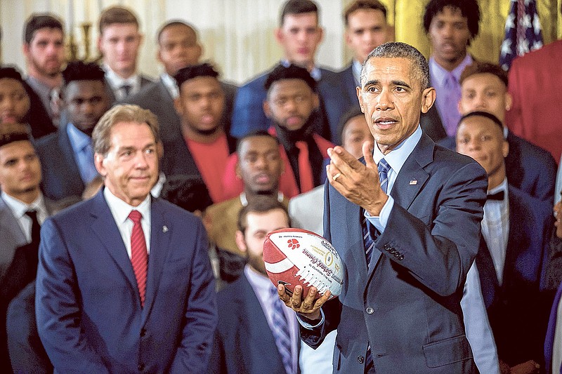 President Barack Obama speaks March 2 at a ceremony celebrating the University of Alabama's win in the 2016 College Football Playoff championship in the East Room at the White House. Coach Nick Saban is at left. Quarterback Tua Tagovailoa, a 6-foot-1, 210-pounder from Honolulu, committed early Tuesday morning to the Crimson Tide.