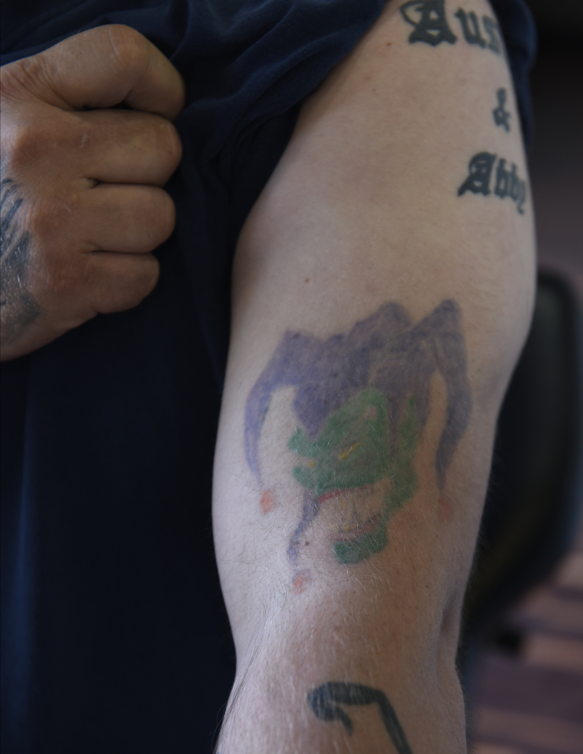 Craig Silvers gave himself his first tattoo, a court jester, on his left bicep. After lightening the original tattoo as seen here, Daniel "Bones" LeLonde of Freedom Tattoo will cover the tattoo with another jester image on Tuesday, Apr. 26, 2016, in Chattanooga, Tenn.