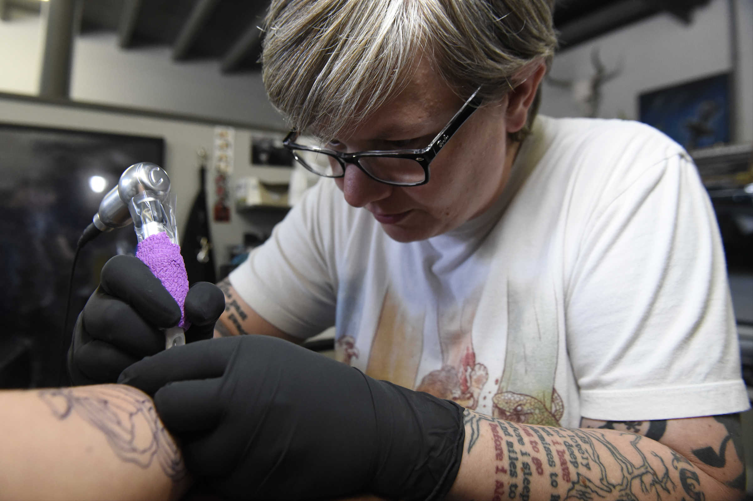 Jennifer Edge of Main Line Ink puts a tattoo on the forearm of Linsey Martin, who drove four hours from Amory, Miss., on Thursday, Apr. 28, 2016, in Chattanooga, Tenn.