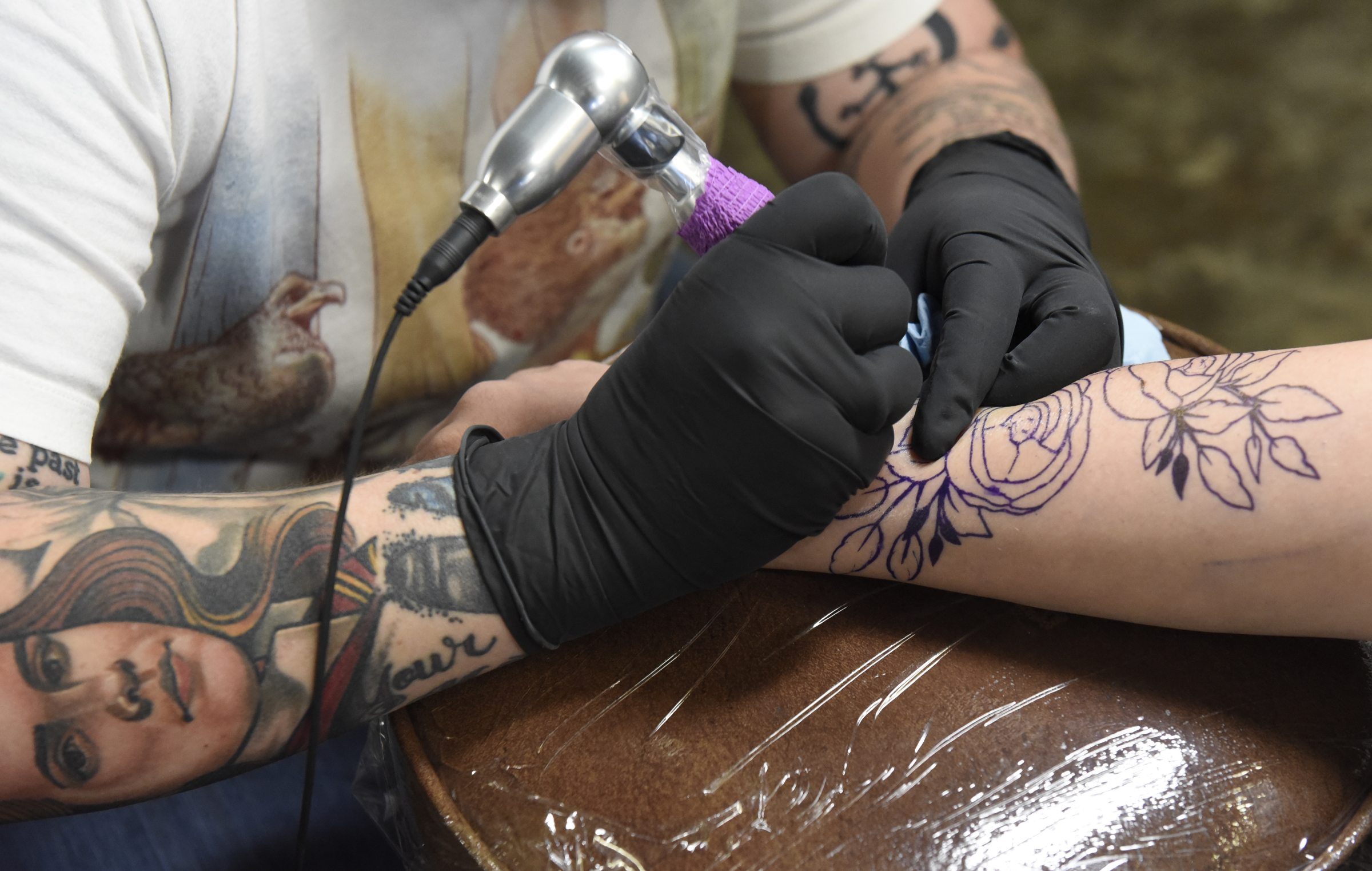 Jennifer Edge of Main Line Ink puts a tattoo on the forearm of Linsey Martin, who drove four hours from Amory, Miss., on Thursday, Apr. 28, 2016, in Chattanooga, Tenn.