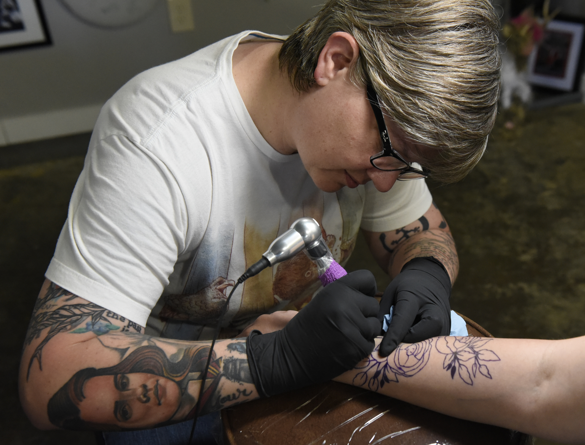 Jennifer Edge of Main Line Ink puts a tattoo on the forearm of Linsey Martin, who drove four hours from Amory, Miss., on Thursday, Apr. 28, 2016, in Chattanooga, Tenn.