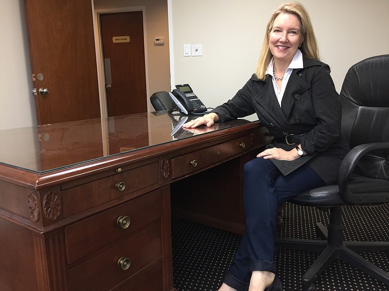 Elizabeth Moore with Adolph Och's old desk in Dalton, Ga.