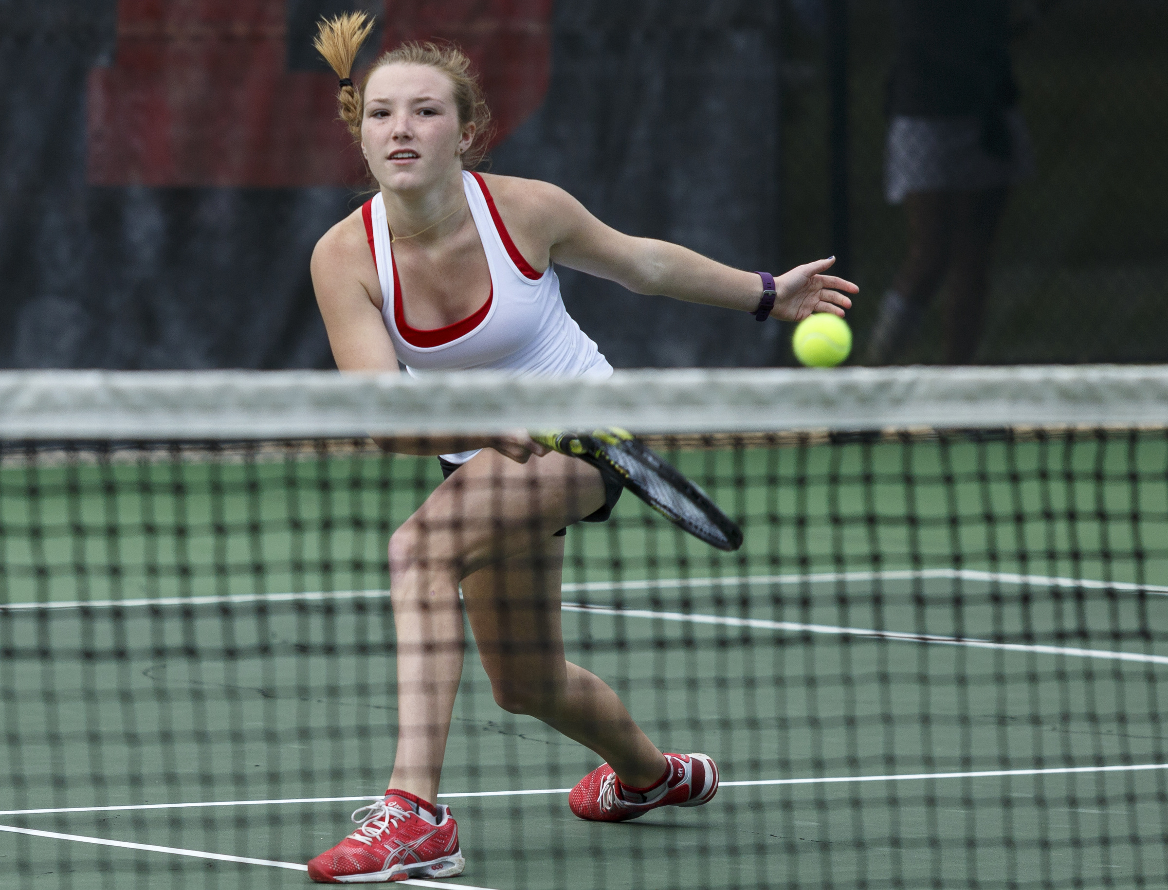 Baylor tennis player Lauren Carelli returns the ball during a doubles match with partner Drew Hawkins against GPS's Maddox Bandy and Jenna Thorstensen during their tennis match at Baylor School on Wednesday, April 4, 2016, in Chattanooga, Tenn.