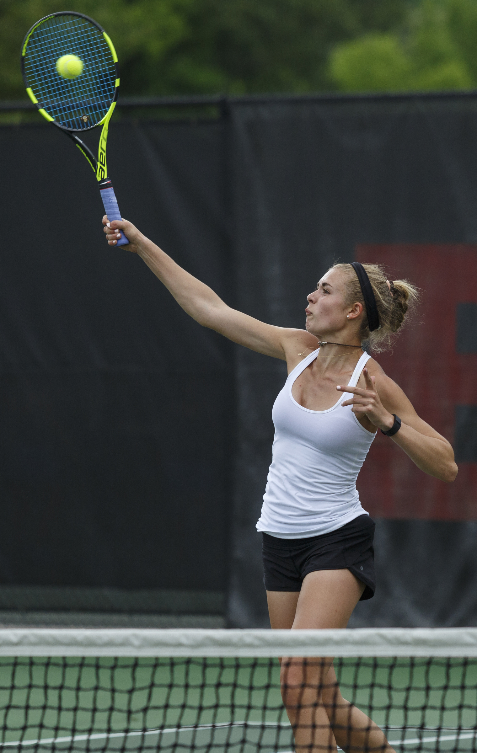 Baylor tennis player Ashton Jenne returns the ball during a doubles match with partner Presley Thomas against GPS's Corrinne Spann and Ellie Edwards during their tennis match at Baylor School on Wednesday, April 4, 2016, in Chattanooga, Tenn.