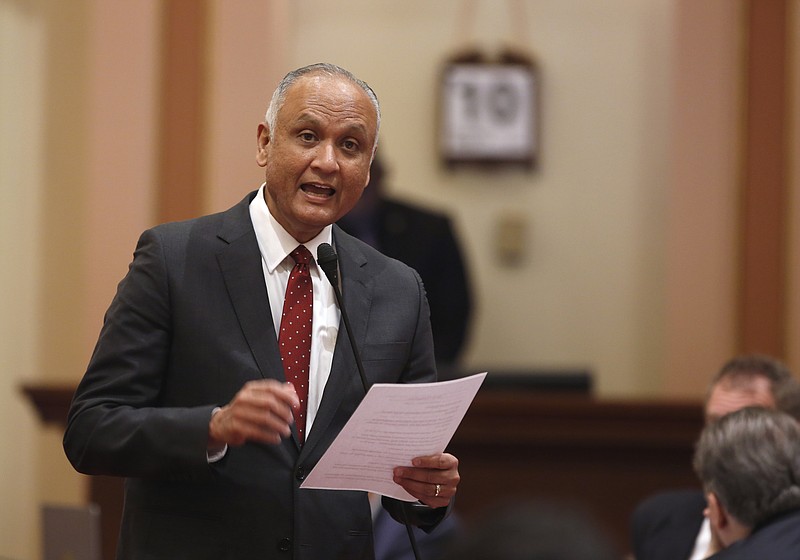 
              FILE- In this March 10, 2016 file photo, State Sen. Ed Hernandez, D-Azusa, urges lawmakers to approve his bill to raise the smoking age from 18 to 21 at the Capitol in Sacramento, Calif. California Gov. Jerry Brown faces a midnight deadline to act on six bills to restrict tobacco use in California, including one to raise the legal age to buy tobacco for smoking, dipping, chewing and vaping from 18 to 21. Brown must sign, veto or return the bills to the Legislature on Wednesday, May 4, or they automatically become law on Thursday. (AP Photo/Rich Pedroncelli, File)
            