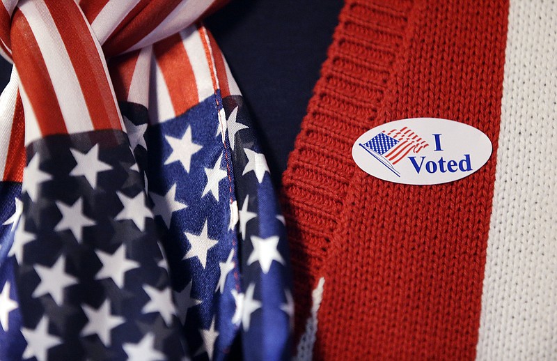 A voter wears a "I Voted" sticker after voting in the Indiana Primary at the Hamilton Co. Auto Auction, Tuesday, May 3, 2016, in Noblesville, Ind. 