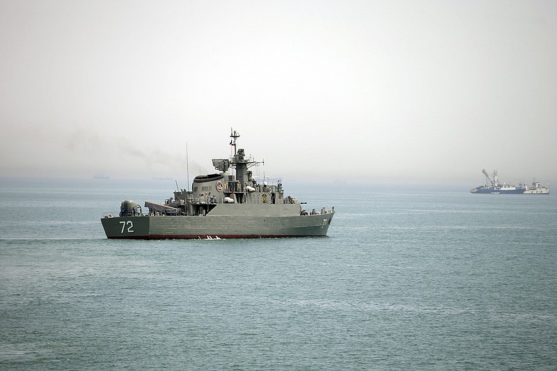 
              FILE - In this Tuesday, April 7, 2015, file photo released by the semi-official Fars News Agency, Iranian warship Alborz, foreground, prepares before leaving Iran's waters, at the Strait of Hormuz.  The deputy commander of Iran's powerful Revolutionary Guard said Iranian forces will close the strategic Strait of Hormuz to the United States and its allies if they "threaten" the Islamic Republic, Iranian state media reported on Wednesday, April 4, 2016. (AP Photo/Fars News Agency, Mahdi Marizad)
            