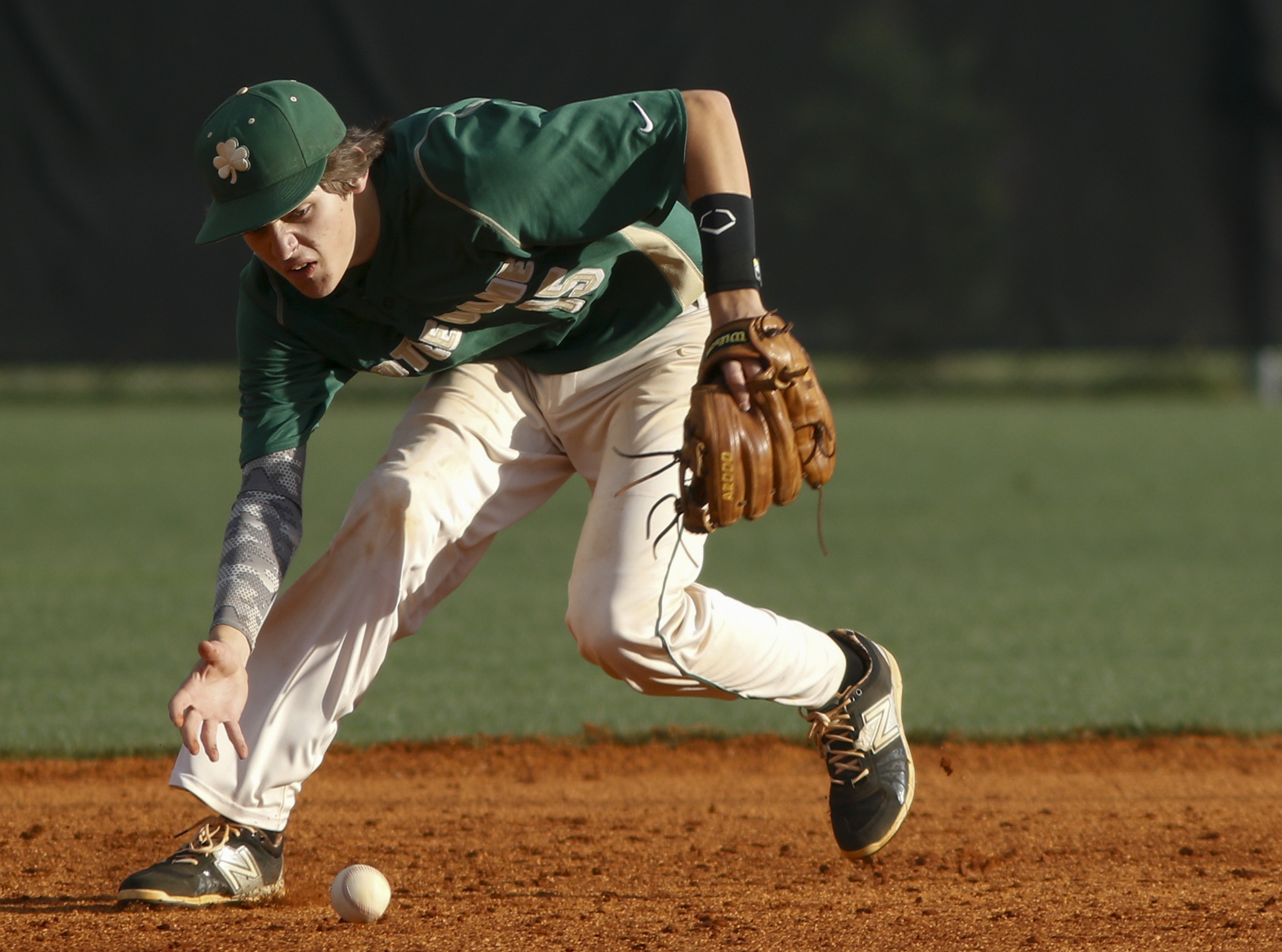 Notre Dame shortstop Alex Florio fields a grounder barehanded during their District 7-AA baseball tournament play-in game against Sequatchie County at Sequatchie County High School on Thursday, May 5, 2016, in Dunlap, Tenn.