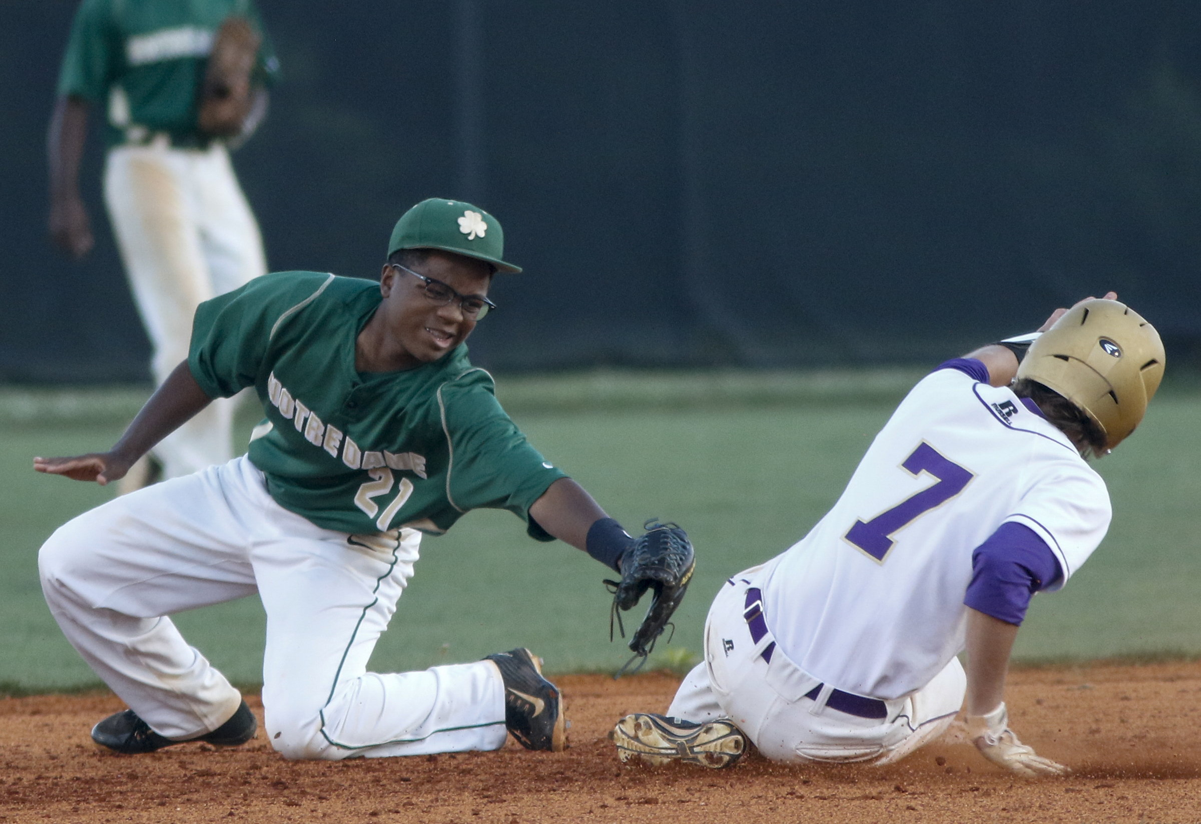 Sequatchie County runner Chase Girdley beats the tag by Notre Dame 2nd baseman Tarik Griffin at 2nd during their District 7-AA baseball tournament play-in game at Sequatchie County High School on Thursday, May 5, 2016, in Dunlap, Tenn.