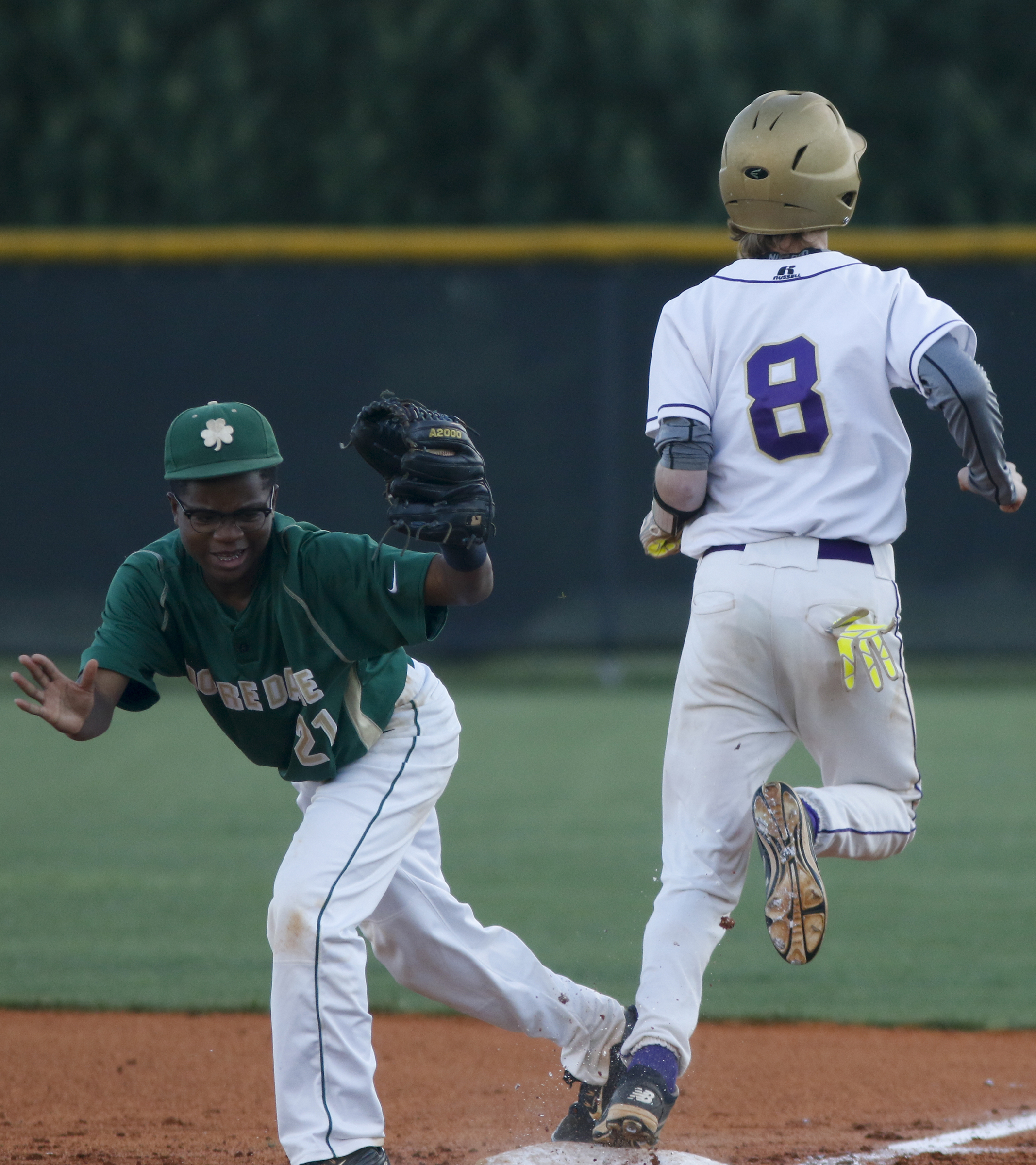 Sequatchie County runner Gage Snyder is forced out at 1st by Notre Dame 2nd baseman Tarik Griffin during their District 7-AA baseball tournament play-in game at Sequatchie County High School on Thursday, May 5, 2016, in Dunlap, Tenn.