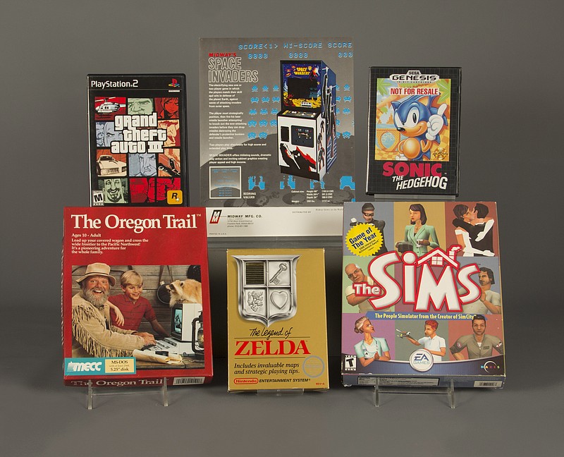 
              In this April 21, 2016 photo provided by The Strong museum in Rochester, N.Y., the 2016 inductees to the World Video Game Hall of Fame are displayed. From top left, clockwise, are "Grand Theft Auto III,"  "Space Invaders," "Sonic the Hedgehog," "The Sims," "The Legend of Zelda," and "The Oregon Trail." (Bethany Mosher/The Strong museum via AP) MANDATORY CREDIT
            