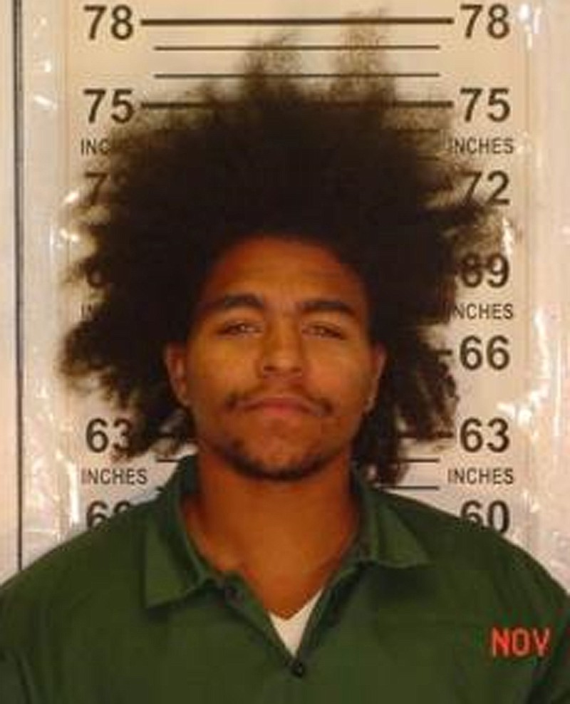 
              This undated image provided by the New York State Department of Corrections, shows Peter Martinez, whose body wound up on the rocky shore near Kingsborough College in Brooklyn, New York, Tuesday, May 3, 2016, investigators said. His feet were set in a plastic bucket filled with concrete that weighed more than 50 pounds. Martinez, 28, had at least 30 prior arrests, for crimes like gun possession and drugs, and was a member of the G-Stone Crips, a local street crew, police said. (New York State Department of Corrections via AP)
            