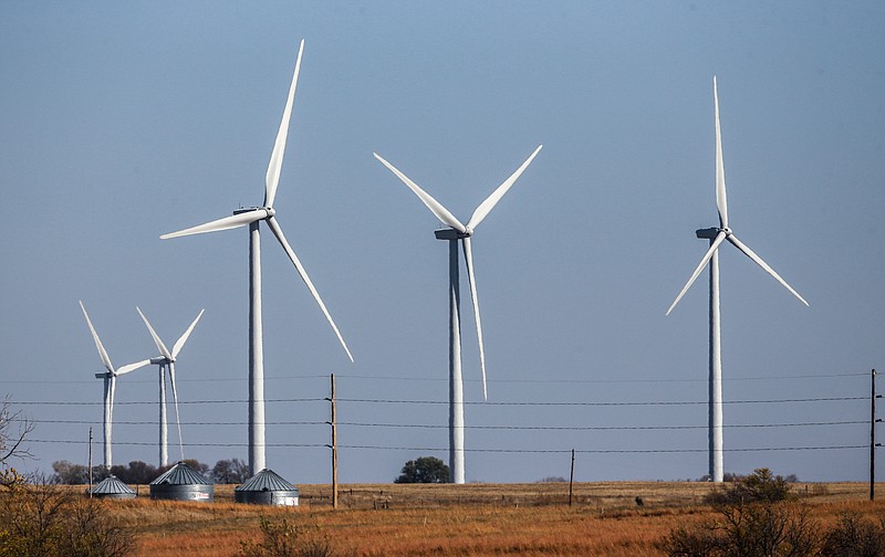 
              FILE - In this Nov. 3, 2015 file photo, wind turbines dot the landscape near Steele City, Neb. Wind turbines and solar panels accounted for more than two-thirds of all new electric generation capacity added to the nation’s grid in 2015, according to a recent analysis by the U.S. Department of Energy. The remaining third was largely new power plants fueled by natural gas, which has become cheap and plentiful as a result of hydraulic fracturing. (AP Photo/Nati Harnik, File)
            