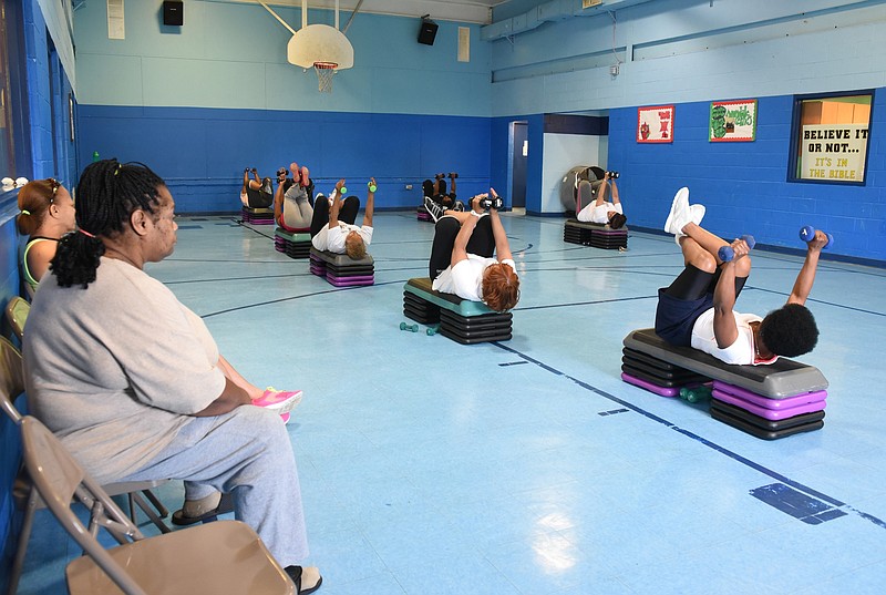 Staff file photo by Tim Barber/Chattanooga Times Free Press - Adult residents exercise in the gym as part of the Health and Wellness Program at the Avondale Recreation Center.