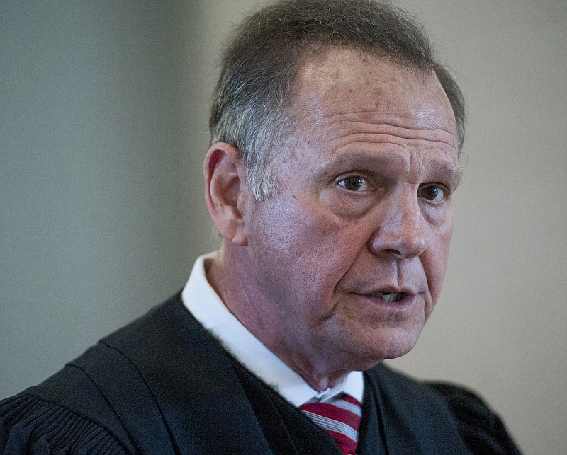 Roy Moore, Chief Justice of the Alabama Supreme Court, speaks during a news conference at the Judicial Building in Montgomery, Ala., Wednesday, April 27, 2016. Moore says a judicial ethics panel should dismiss complaints filed against him as he fought to keep gays and lesbians from marrying in the state. (Mickey Welsh/Montgomery Advertiser via AP)