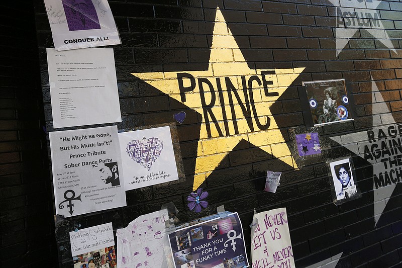 
              A star honoring Prince, now painted gold, stands out on the wall Thursday, May 5, 2016 at a memorial for the singer at First Avenue in Minneapolis, a venue where he often performed. The pop rock singer died on April 21 at the age of 57. (AP Photo/Jim Mone)
            