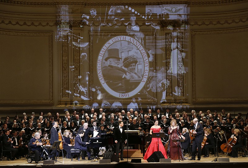 
              From left, Itzhak Perlman, Yo-Yo Ma, Lang Lang, Emanuel Ax, Michael Feinstein, Isabel Leonard, Renee Fleming and James Taylor perform during Carnegie Hall's 125th Anniversary Concert, Thursday, May 5, 2016, in, New York. The Oratorio Society of New York sang along as the Orchestra of St. Lukes played conducted by Pablo Heras-Casado. (AP Photo/Julie Jacobson)
            