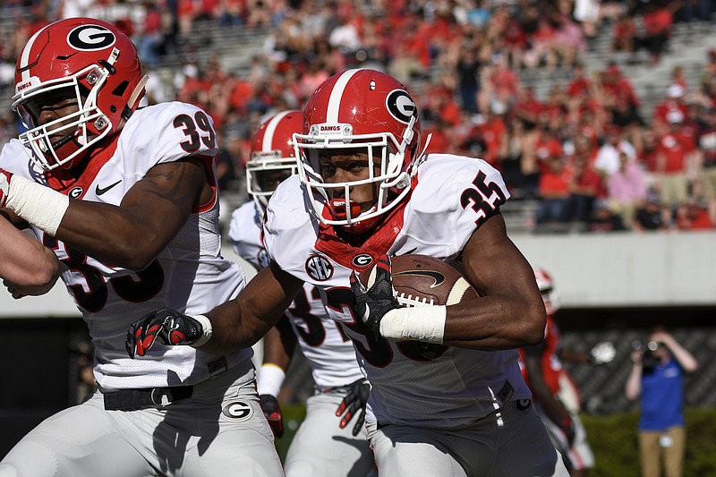 Georgia redshirt junior cornerback Aaron Davis collected the only turnover at last month's G-Day game with a 98-yard interception return for a touchdown and got a lacrosse stick as a result.