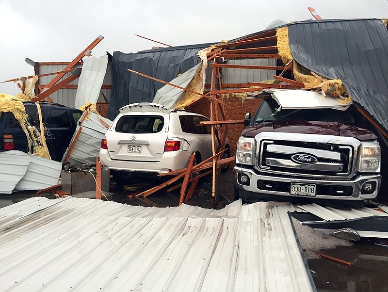 
              Debris lies on damaged vehicles after a tornado was reported in Weld County outside Wiggins, Colo., Saturday, May 7, 2016. Spring storms menaced parts of the West on Saturday, bringing hail and a tornado sighting in Colorado and deadly driving conditions in Arizona. (Kristen Skovira/KMGH-Channel 7 via AP) MANDATORY CREDIT
            