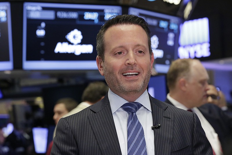 
              FILE - In this Wednesday, April 6, 2016, file photo, Allergan CEO Brent Saunders is interviewed on the floor of the New York Stock Exchange. Allergan will buy back up to $10 billion in stock following a swing to a first-quarter profit on a strong surge in sales of key drugs, including the wrinkle and muscle spasm treatment Botox, the company announced Tuesday, May 10. The share buyback plan is contingent on the sale of the drug developer's generics unit to Teva, which is expected to close by the end of the year. Meanwhile, the company is consolidating its executive team under current CEO Saunders. (AP Photo/Richard Drew, File)
            