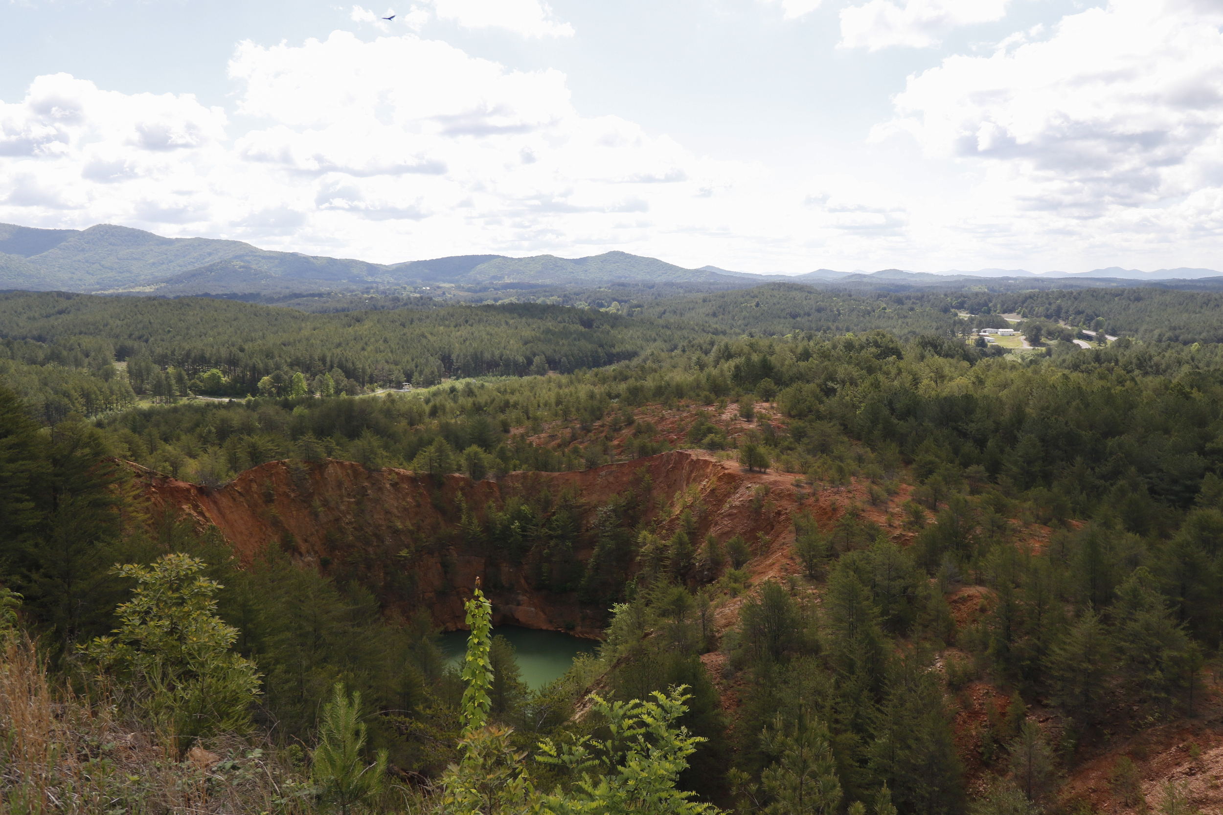 A collapsed mine is visible from an overlook at the Ducktown Basin Museum.