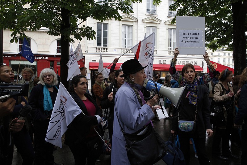 
              Feminist groups gather during a protest to demand an end to widespread sexism in French politics, next to the National Assembly in Paris, Wednesday, May 11, 2016. Two French government ministers and a top legislator stand accused of sexually harassing or abusing women _ allegedly grabbing breasts, tweaking thong underwear or other inappropriate behavior in the workplace. (AP Photo/Christophe Ena)
            