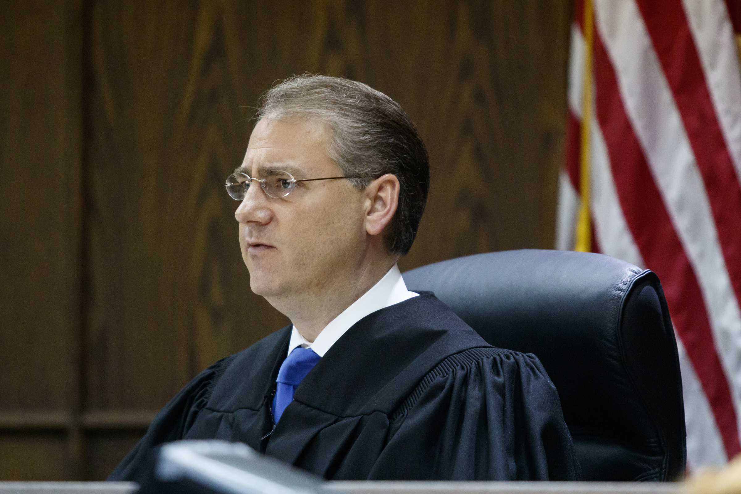 Judge Tom Greenholtz listens as Ooltewah Athletic Director Allard "Jesse" Nayadley takes a pre-trial diversion of his charge of failure to report child abuse on Wednesday, May 11, 2016, in Chattanooga, Tenn. The pre-trial diversion allows the charge, which came after the December 2015 sexual assault of a basketball player by teammates, to be dismissed after 180 days if Nayadley meets certain conditions.