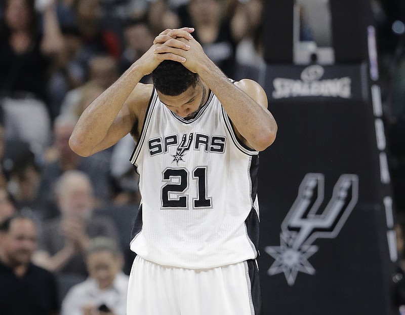 
              San Antonio Spurs forward Tim Duncan holds his hands over his head after a play during the second half in Game 5 of the team's second-round NBA basketball playoff series against the Oklahoma City Thunder, Tuesday, May 10, 2016, in San Antonio. Oklahoma City won 95-91. (AP Photo/Eric Gay)
            