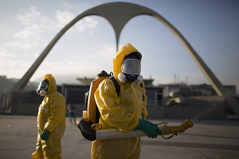 
              FILE - In this Tuesday, Jan. 26, 2016 file photo, a health workers stands in the Sambadrome spraying insecticide to combat the Aedes aegypti mosquito that transmits the Zika virus in Rio de Janeiro, Brazil. The Sambadrome will be used for the Archery competition during the 2016 summer games. With the opening ceremony less than three months away, a Canadian professor has called for the Rio Olympics to be postponed or moved because of the Zika outbreak, warning the influx of visitors to Brazil will result in the avoidable birth of malformed babies. The IOC and World Health Organization disagree, saying Zika will not derail the games.   (AP Photo/Leo Correa, File)
            