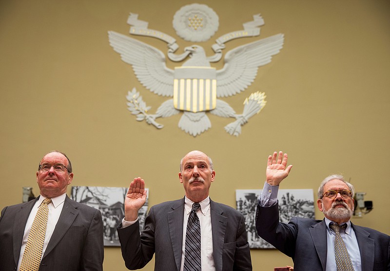 
              Washington, D.C. City Council Chairman Phil Mendelson, center, flanked by former Greenstein Delorme and Luchs partner Jacques DePuy, left, and former District of Columbia Attorney General Irvin Nathan, right, are sworn in on Capitol Hill in Washington, Thursday, May 12, 2016, prior to testifying before the House Government Operation subcommittee hearing on whether the District of Columbia government truly has the power to spend local tax dollars without approval by Congress. (AP Photo/Andrew Harnik)
            