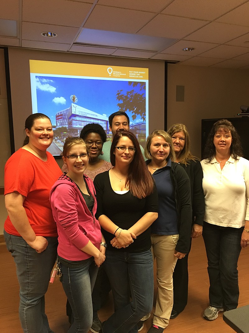 Associates from Wal-Mart Supercenter 5173 in Dalton, Ga., view plans for new Children's Hospital at Erlanger.