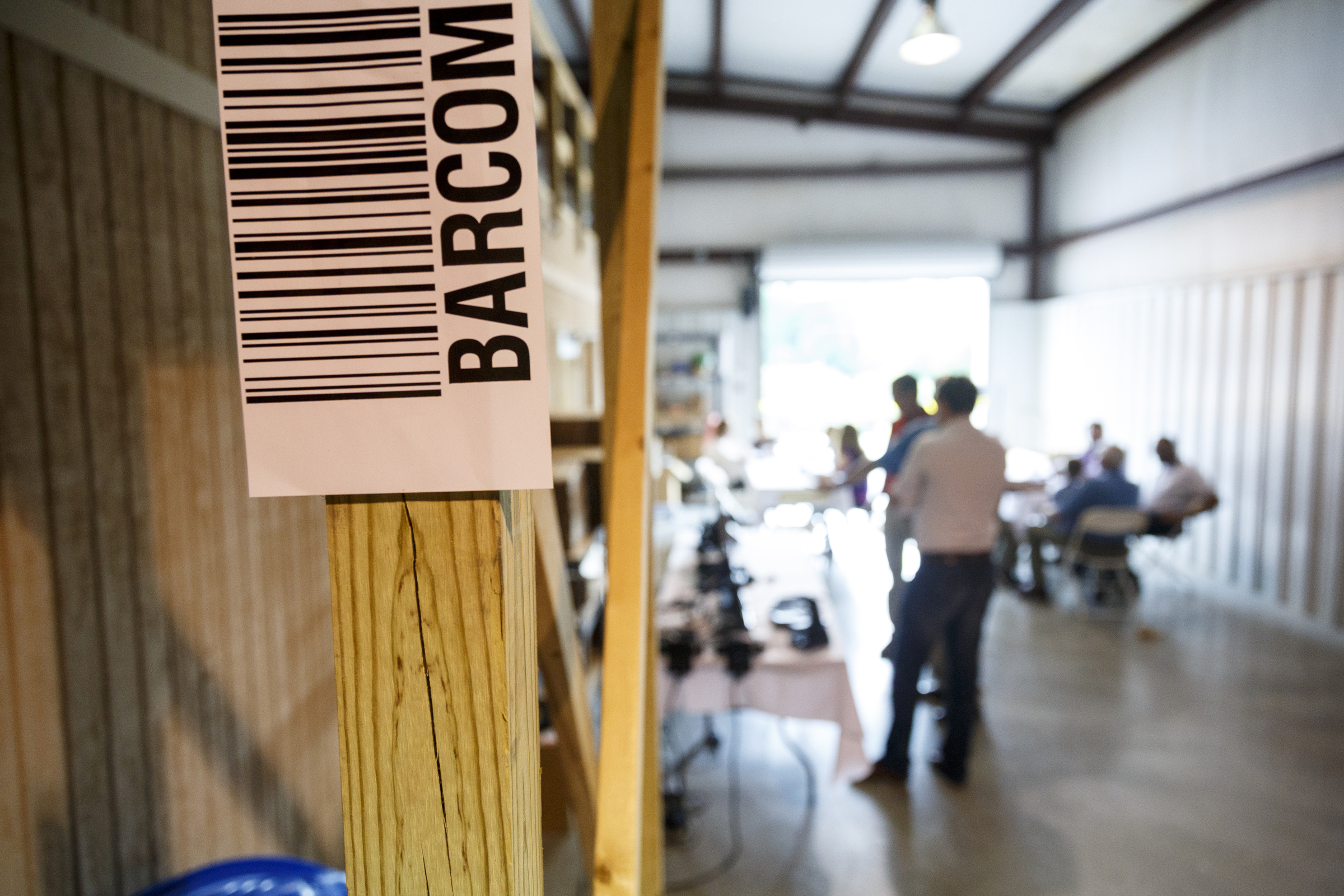 A barcode scanner is stuck to a post for a scanning activity during an open house at the company Barcom on Thursday, May 12, 2016, in Chattanooga, Tenn. The business, which makes equipment for managing and scanning bar codes, is celebrating its 25th year.