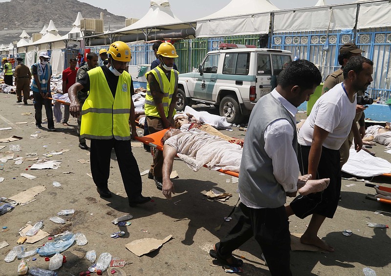 
              FILE - In this Thursday, Sept. 24, 2015 file photo, emergency services personnel attend to victims of a stampede in Mina, Saudi Arabia during the annual hajj pilgrimage. Iran will not send pilgrims to Saudi Arabia this year for the annual hajj pilgrimage, an Iranian official announced Thursday, May 12, 2016 the latest sign of tensions between the two Mideast powers after a disaster during the event last year killed at least 2,426 people. (AP Photo, File)
            