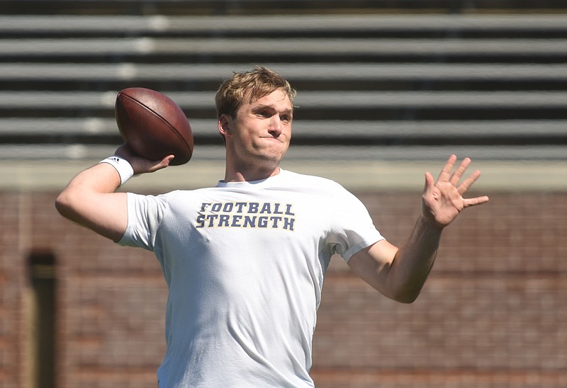 Jacob Huesman works out for NFL scouts during UTC's pro day at Finley Stadium in late March. Although not drafted, he had a tryout with the Pittsburgh Steelers and is at the Tennessee Titans' rookie camp in Nashville this weekend.