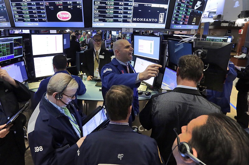 
              Specialist Philip Finale, background center, works with traders at the post that handles Monsanto on the floor of the New York Stock Exchange, Thursday, May 12, 2016. Monsanto jumped 9 percent on reports that Bayer is in talks to buy it. (AP Photo/Richard Drew)
            