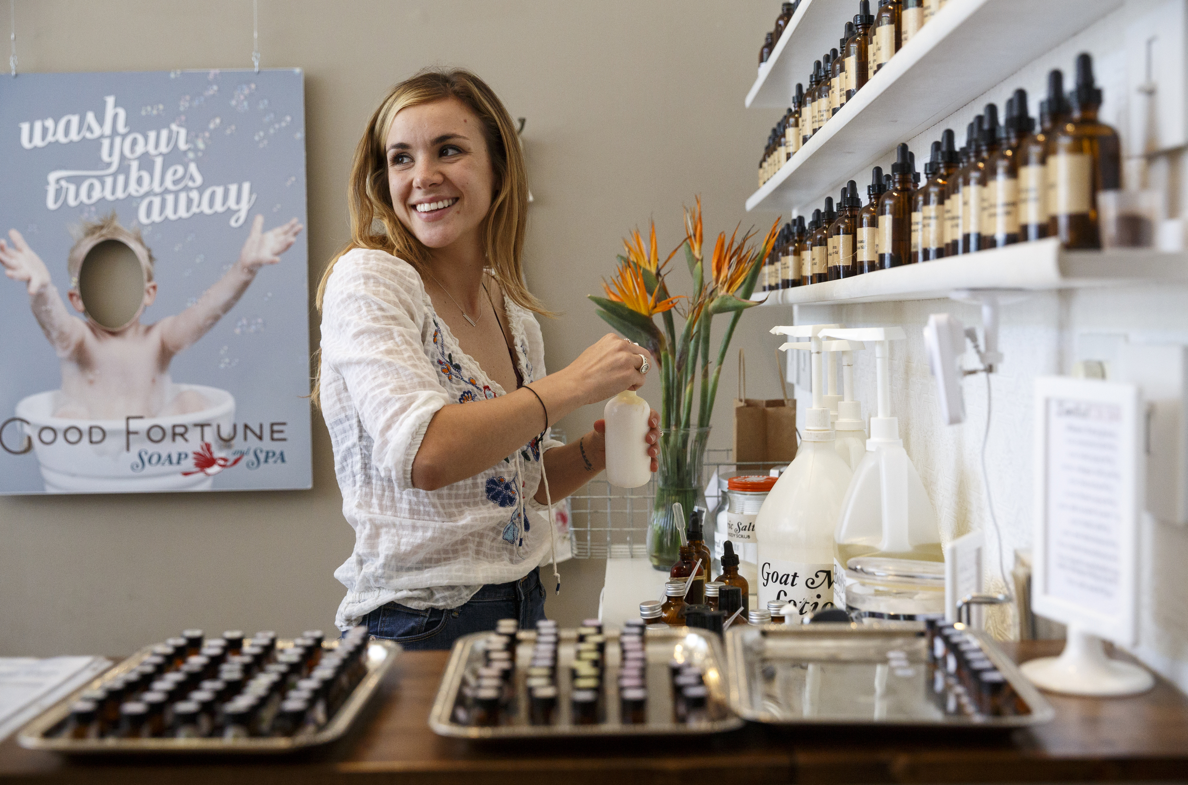 Anna Underdown mixes a custom scented hand lotion at Good Fortune Soap and Spa, which sells essential oils and custom mixes them into products, on Friday, May 13, 2016, in Chattanooga, Tenn. Some essential oils can be toxic if ingested or misused, so it is important to always use products which contain them as directed.
