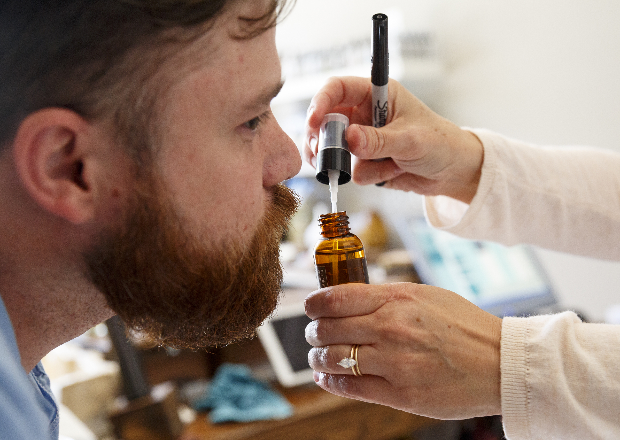Jason Vance test-sniffs a custom-scented beard oil at Good Fortune Soap and Spa, which sells essential oils and custom mixes them into products, on Friday, May 13, 2016, in Chattanooga, Tenn. Some essential oils can be toxic if ingested or misused, so it is important to always use products which contain them as directed.